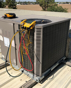 HVAC unit with service gauges connected